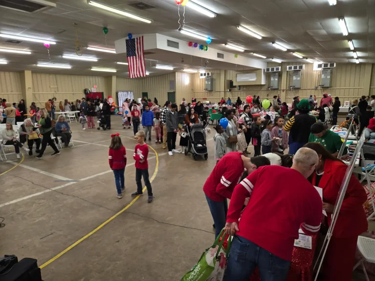 The Fiesta hall filled with families and volunteers in red shirts